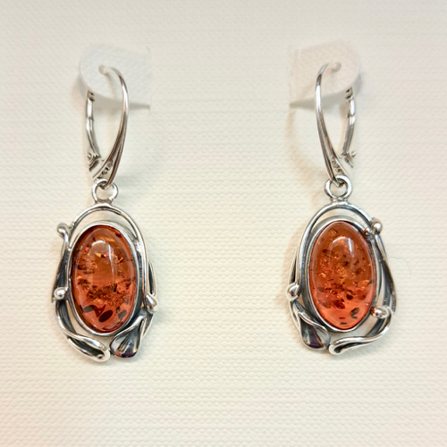 Click to view detail for HWG-2341 Earrings Oval Rum Amber framed in Silver Dangle $60